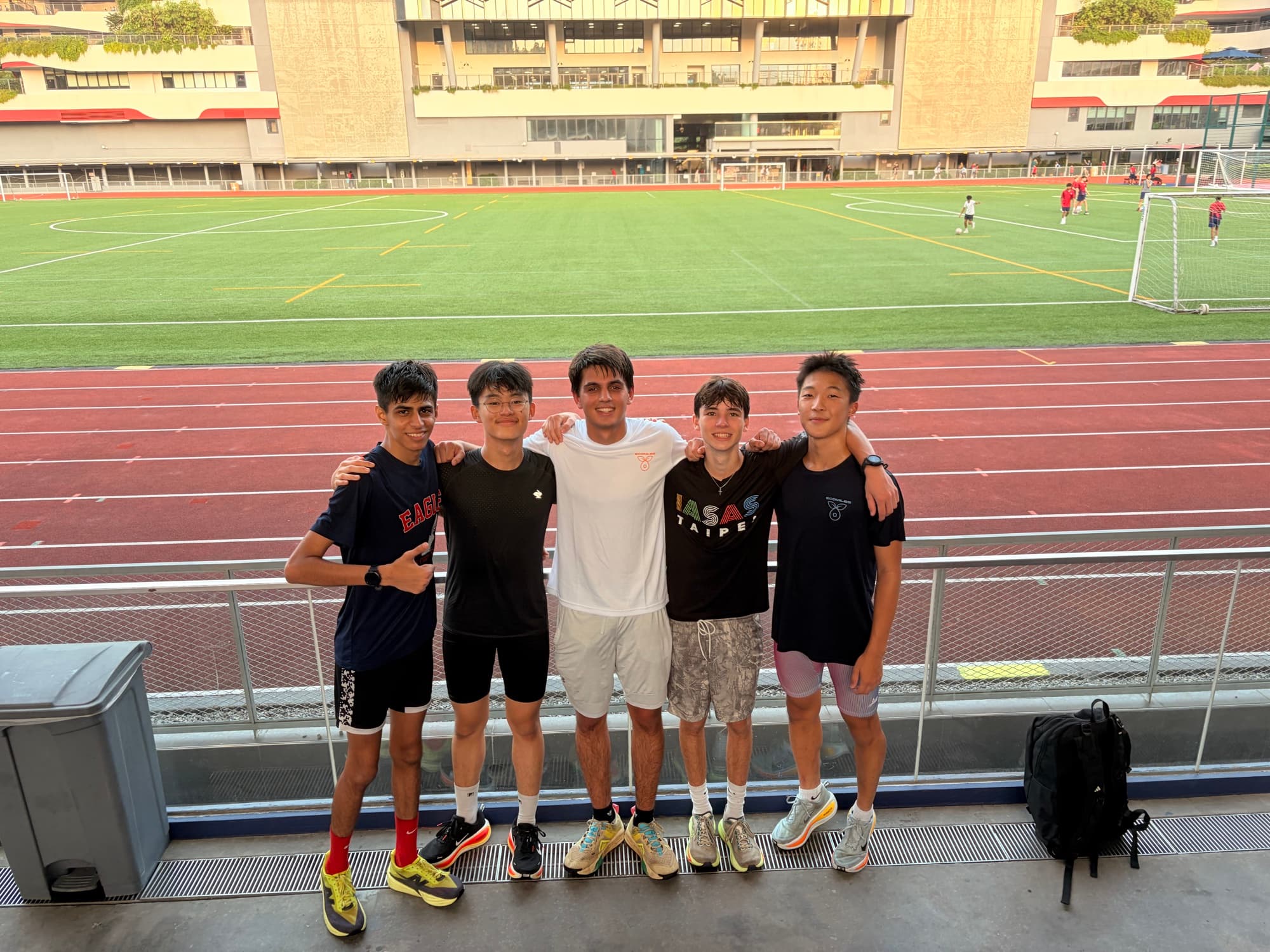 Sam with his cross country team on the track field