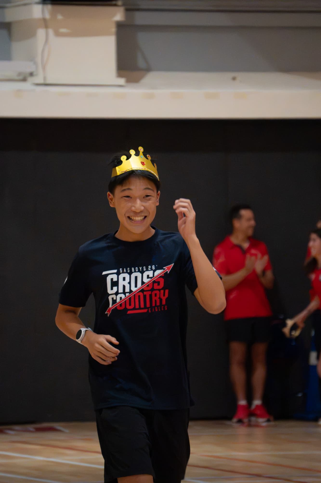 Sam wearing a crown at the track banquet